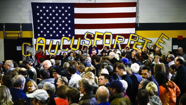 Attendees hold letters that read CAUCUS FOR PETE before Democratic presidential candidate former South Bend, Ind., Mayor Pete Buttigieg arrives to speak during campaign event at Northwest Junior High, Sunday, Feb. 2, 2020, in Coralville, Iowa. Attendees hold letters that read CAUCUS FOR PETE before Democratic presidential candidate former South Bend, Ind., Mayor Pete Buttigieg arrives to speak during campaign event at Northwest Junior High, Sunday, Feb. 2, 2020, in Coralville, Iowa. - Sputnik International