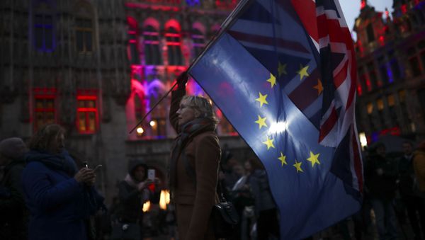 A woman holds up the Union and the European Union flags during an event called Brussels calling to celebrate the friendship between Belgium and Britain at the Grand Place in Brussels, Thursday, Jan. 30, 2020 A woman holds up the Union and the European Union flags during an event called Brussels calling to celebrate the friendship between Belgium and Britain at the Grand Place in Brussels, Thursday, Jan. 30, 2020 - Sputnik International