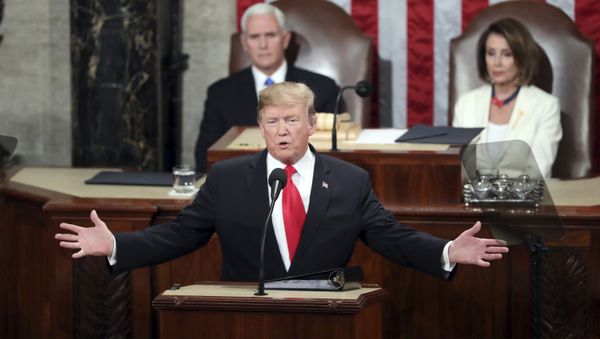 In this Feb. 5, 2019, file photo, President Donald Trump delivers his State of the Union address to a joint session of Congress on Capitol Hill in Washington, as Vice President Mike Pence and Speaker of the House Nancy Pelosi, D-Calif., watch. - Sputnik International