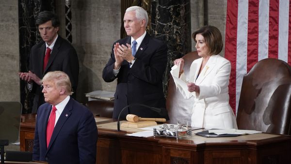 Speaker of the House Nancy Pelosi (D-CA) rips up U.S. President Donald Trump's speech alongside Vice President Mike Pence following the State of the Union address to a joint session of the U.S. Congress in the House Chamber of the U.S. Capitol in Washington, U.S., February 4, 2020 - Sputnik International