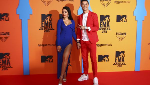 Soccer player Cristiano Ronaldo, right, and Georgina Rodriguez pose for photographers upon arrival at the European MTV Awards in Seville, Spain, 3 November 2019. Soccer player Cristiano Ronaldo, right, and Georgina Rodriguez pose for photographers upon arrival at the European MTV Awards in Seville, Spain, 3 November 2019. - Sputnik International