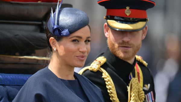 In this file photo taken on June 08, 2019 Britain's Meghan, Duchess of Sussex (L) and Britain's Prince Harry, Duke of Sussex (R) return to Buckingham Palace after the Queen's Birthday Parade, 'Trooping the Colour', in London - Sputnik International