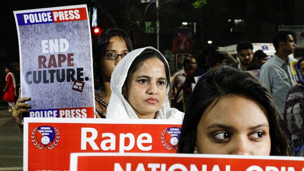FILE- In this Dec. 4, 2019, file photo, Indians walk with placards during a protest demanding justice in the case of a veterinarian who was gang-raped and killed the previous week, in Kolkata, India - Sputnik International