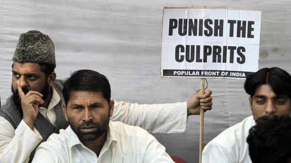 Indian Muslim activists of Popular Front of India sit at a protest in New Delhi, India, Tuesday, Dec. 6, 2011 to mark the anniversary of the Babri mosque demolition Indian Muslim activists of Popular Front of India sit at a protest in New Delhi, India, Tuesday, Dec. 6, 2011 to mark the anniversary of the Babri mosque demolition - Sputnik International