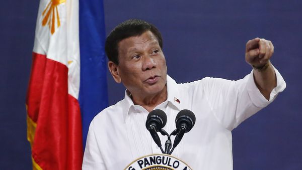 FILE - In this Aug. 27, 2019, file photo, Philippine President Rodrigo Duterte addresses land reform beneficiaries on the 31st year of the implementation of the Comprehensive Agrarian Reform Program (CARP) in suburban Quezon city, northeast of Manila, Philippines. A spokesman said Thursday, Oct. 17, 2019 FILE - In this Aug. 27, 2019, file photo, Philippine President Rodrigo Duterte addresses land reform beneficiaries on the 31st year of the implementation of the Comprehensive Agrarian Reform Program (CARP) in suburban Quezon city, northeast of Manila, Philippines. A spokesman said Thursday, Oct. 17, 2019 - Sputnik International