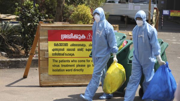 Indian workers walk with garbage after cleaning an isolation ward at a hospital for observing people suspected to have a new coronavirus infection in Kochi, Kerala state, India, Tuesday, Feb.4, 2020. Indian workers walk with garbage after cleaning an isolation ward at a hospital for observing people suspected to have a new coronavirus infection in Kochi, Kerala state, India, Tuesday, Feb.4, 2020. - Sputnik International