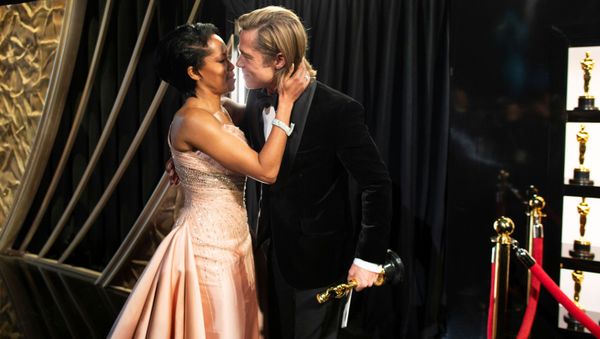 Best Supporting Actor Brad Pitt embraces Regina King as he holds his Oscar at the 92nd Academy Awards in Hollywood, Los Angeles, California on 9 February 2020.  - Sputnik International