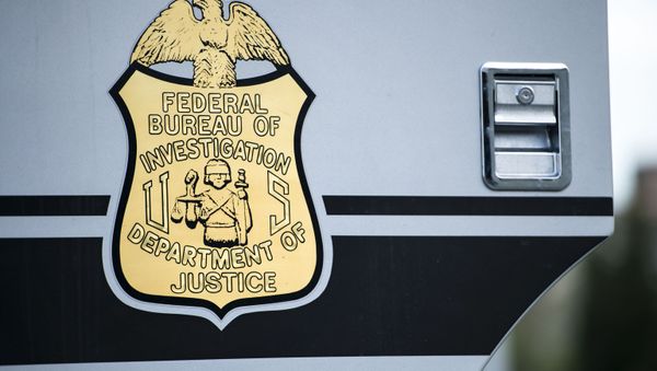 A seal on a door to a Federal Bureau of Investigation mobile command vehicle is seen during an FBI field training exercise at the Landmark Mall May 2, 2014 in Alexandria, Virginia.  - Sputnik International