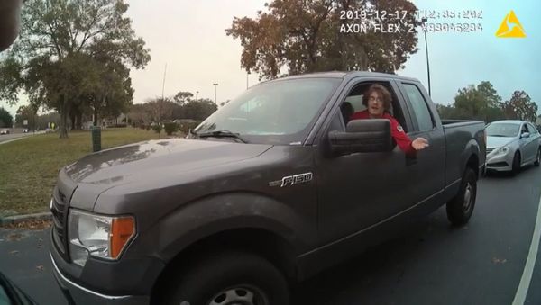 Body camera recording captures moment an unidentified officer with Florida's Pasco County Sheriff’s Office threatens to shoot a student attempting to leave school grounds. - Sputnik International
