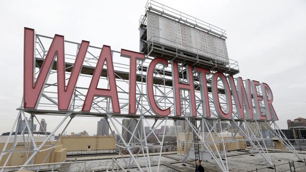 In this Wednesday, Dec. 9, 2015, photo, the iconic Watchtower sign is seen on the roof of 25-30 Columbia Heights, the current world headquarters of the Jehovah's Witnesses, in the Brooklyn borough of New York. This building is one of three large properties being sold by the Jehovah's Witnesses in a crowded area near the Brooklyn waterfront - Sputnik International