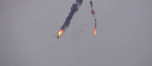 The video shows dramatic footage of the helicopter in flames going down in Idlib The video shows dramatic footage of the helicopter in flames going down in Idlib - Sputnik International