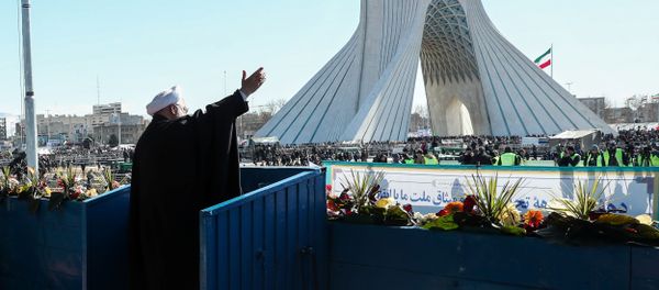 Iranian President Hassan Rouhani salutes the crowd during the commemoration of the 41st anniversary of the Islamic revolution in Tehran Iranian President Hassan Rouhani salutes the crowd during the commemoration of the 41st anniversary of the Islamic revolution in Tehran - Sputnik International