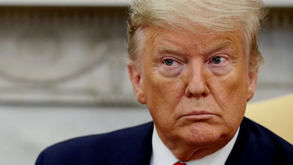 U.S. President Donald Trump listens to questions while meeting with Ecuador's President Lenin Moreno in the Oval Office of the White House in Washington, U.S., February 12, 2020. - Sputnik International