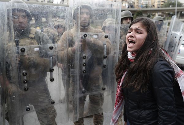 An anti-government protester shouts slogans in front of Lebanese army soldiers, in downtown Beirut, Lebanon, Tuesday, Feb. 11, 2020. An anti-government protester shouts slogans in front of Lebanese army soldiers, in downtown Beirut, Lebanon, Tuesday, Feb. 11, 2020. - Sputnik International