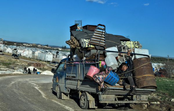 Displaced Syrians arrive at a camp for the internally displaced near Dayr Ballut, near the Turkish border in the rebel-held part of Aleppo province on February 9, 2020. Displaced Syrians arrive at a camp for the internally displaced near Dayr Ballut, near the Turkish border in the rebel-held part of Aleppo province on February 9, 2020. - Sputnik International