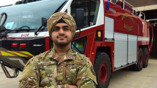 Airman 1st Class Jaspreet Singh, the first Airman at Joint Base McGuire-Dix-Lakehurst to wear a U.S. Air Force approved turban as a uniform item stands in front of a fire truck at Fire Station 1, Joint Base MDL, Dec. 5, 2019 - Sputnik International