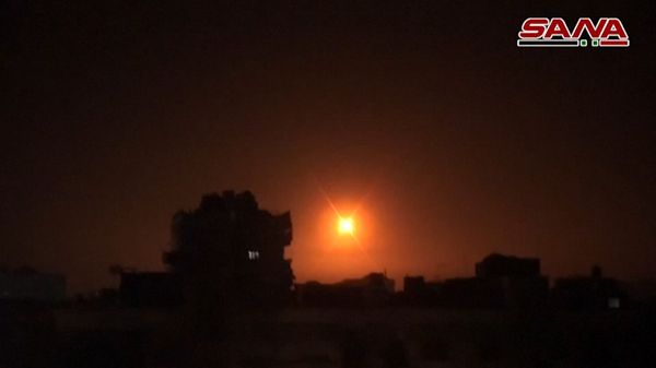 An image grab obtained from handout footage released by the official Syrian Arab News Agency (SANA) on February 14, 2020, reportedly shows footage of Syrian air defence firing into the sky and exploding during a reported Israeli missile attack near Damascus - Sputnik International