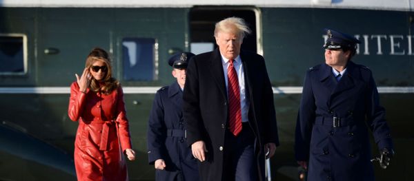 U.S. President Donald Trump and first lady Melania Trump walk from Marine One to board Air Force One as they depart Washington for travel to Florida at Joint Base Andrews, Maryland, U.S., February 14, 2020. - Sputnik International