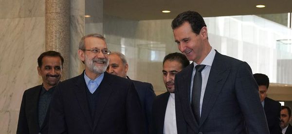 A handout picture released by the official Facebook page for the Syrian Presidency on February 16, 2020, shows Syrian President Bashar al-Assad (R) welcoming Iran's Parliament Speaker Ali Larijani in the capital Damascus A handout picture released by the official Facebook page for the Syrian Presidency on February 16, 2020, shows Syrian President Bashar al-Assad (R) welcoming Iran's Parliament Speaker Ali Larijani in the capital Damascus - Sputnik International