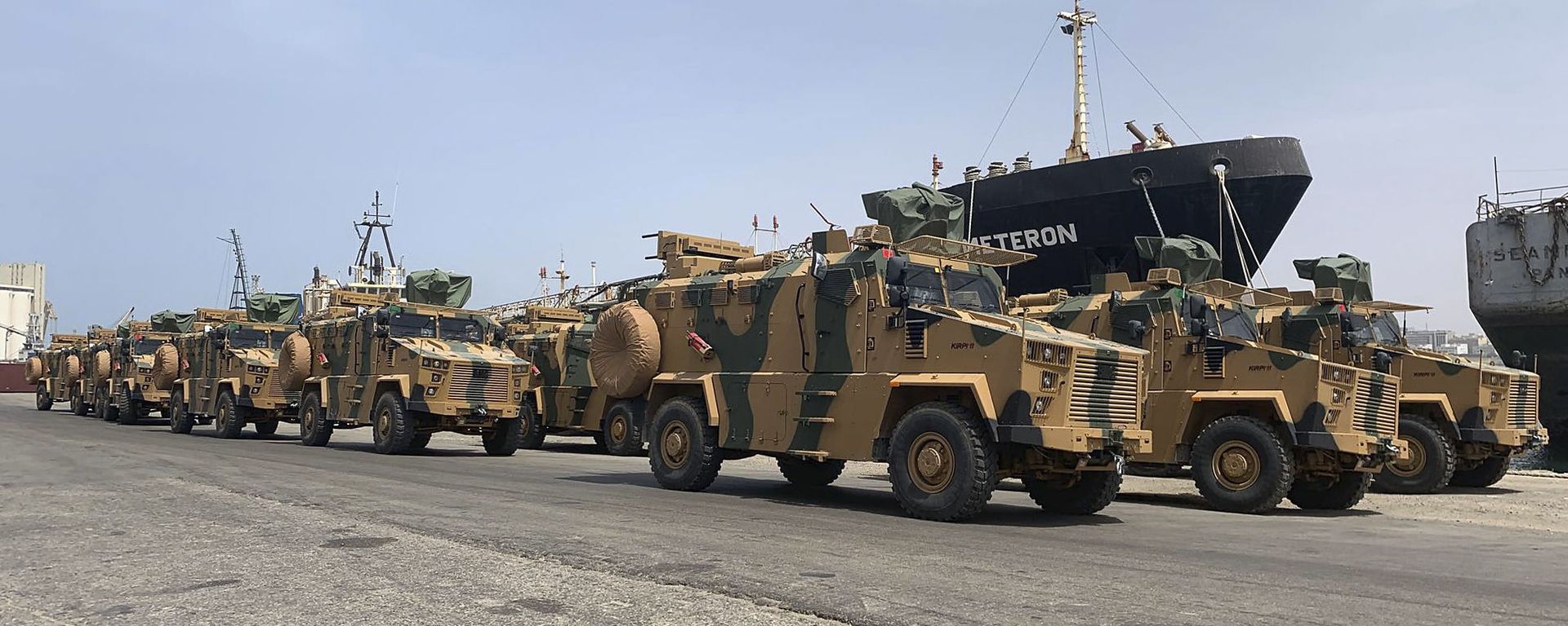 A photo posted on the Facebook Page of the media bureau of Volcano of Anger operation on May 18, 2019, reportedly shows Turkish-made armoured personnel vehicles, shipped to Libya's internationally recognised Government of National Accord (GNA), arriving at Tripoli port A photo posted on the Facebook Page of the media bureau of Volcano of Anger operation on May 18, 2019, reportedly shows Turkish-made armoured personnel vehicles, shipped to Libya's internationally recognised Government of National Accord (GNA), arriving at Tripoli port - Sputnik International, 1920, 17.02.2020