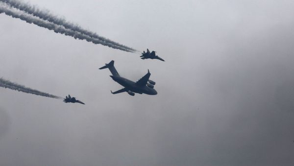 A bird flies past as an Indian Navy P-8I Poseidon - Sputnik International