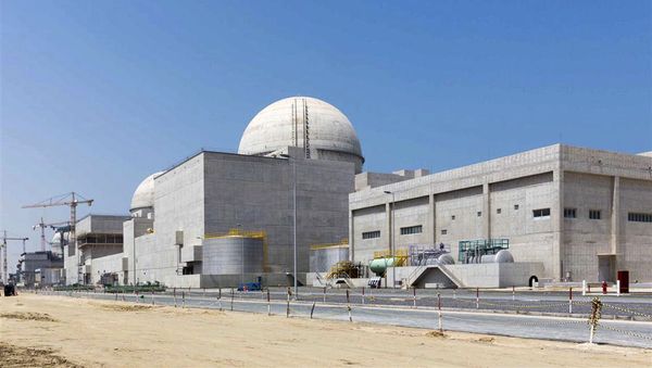 This undated photograph released by the United Arab Emirates' state-run WAM news agency, shows the under-construction Barakah nuclear power plant in Abu Dhabi's Western desert. South Korean President Moon Jae-in's visit to the United Arab Emirates this week shows the Asian nation's deepening cooperation with the Gulf country, from buying its oil to building the Arabian Peninsula's first nuclear power plant and potentially backing it in war - Sputnik International