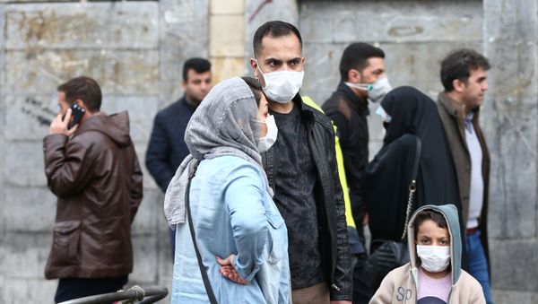 Iranian family wear protective masks to prevent contracting a coronavirus, as they stand at Grand Bazaar in Tehran, Iran February 20, 2020. Iranian family wear protective masks to prevent contracting a coronavirus, as they stand at Grand Bazaar in Tehran, Iran February 20, 2020. - Sputnik International