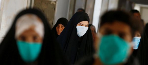 Iraqi people wear protective masks, following the outbreak of the new coronavirus, at a hospital in Najaf, Iraq February 23, 2020 Iraqi people wear protective masks, following the outbreak of the new coronavirus, at a hospital in Najaf, Iraq February 23, 2020 - Sputnik International