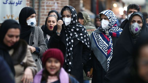 Iranian women wearing protective masks to prevent contracting a coronavirus walk at Grand Bazaar in Tehran, Iran February 20, 2020. Iranian women wearing protective masks to prevent contracting a coronavirus walk at Grand Bazaar in Tehran, Iran February 20, 2020. - Sputnik International