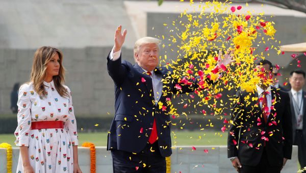 U.S. President Donald Trump and first lady Melania Trump attend a wreath laying ceremony at Mahatma Gandhi's memorial at Raj Ghat in New Delhi, India, February 25, 2020 U.S. President Donald Trump and first lady Melania Trump attend a wreath laying ceremony at Mahatma Gandhi's memorial at Raj Ghat in New Delhi, India, February 25, 2020 - Sputnik International