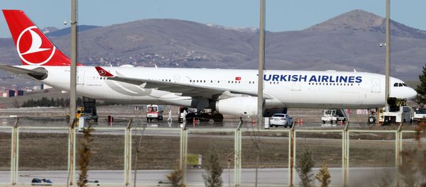 Ambulances are seen near a Turkish Airlines (THY) plane from Tehran after landing at Esenboga International Airport in Ankara, Turkey, February 25, 2020 - Sputnik International