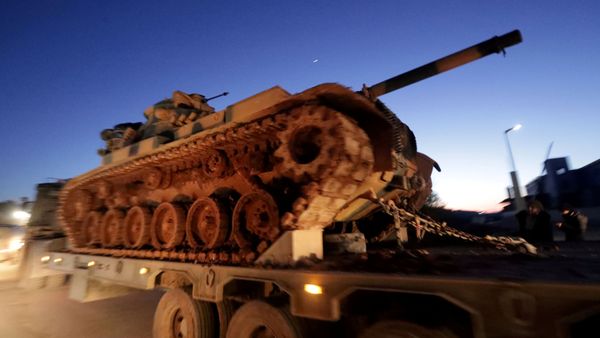 Turkish military vehicles enter the Bab al-Hawa crossing at the Syrian-Turkish border, in Idlib governorate, Syria, February 9, 2020 - Sputnik International