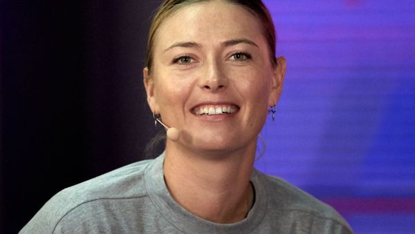 Maria Sharapova, of Russia, speaks with the media during the news conference at the St. Petersburg Ladies Trophy, in St. Petersburg, Russia. Sharapova withdrew from tournament with shoulder injury - Sputnik International