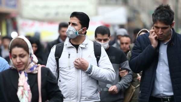 Iranian men wearing protective masks to prevent contracting a coronavirus walk at Grand Bazaar in Tehran, Iran February 20, 2020 Iranian men wearing protective masks to prevent contracting a coronavirus walk at Grand Bazaar in Tehran, Iran February 20, 2020 - Sputnik International