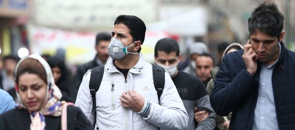 Iranian men wearing protective masks to prevent contracting a coronavirus walk at Grand Bazaar in Tehran, Iran February 20, 2020 Iranian men wearing protective masks to prevent contracting a coronavirus walk at Grand Bazaar in Tehran, Iran February 20, 2020 - Sputnik International