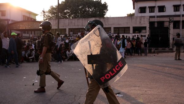 Policemen patrol in a riot affected area after clashes erupted between people demonstrating for and against a new citizenship law in New Delhi, India, February 25, 2020.  - Sputnik International