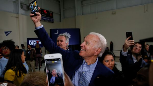 Democratic U.S. presidential candidate and former U.S. Vice President Joe Biden takes a selfie with people at the end of a campaign event in Sumter, South Carolina, U.S., February 28, 2020 - Sputnik International