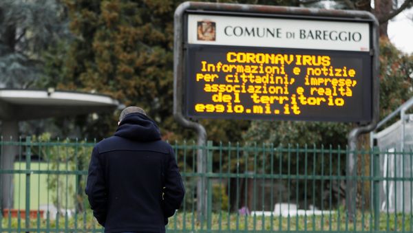 Schoolteacher Alessio Villarosa walks on a street in the small town of Bareggio near Milan, Italy February 29, 2020.  - Sputnik International