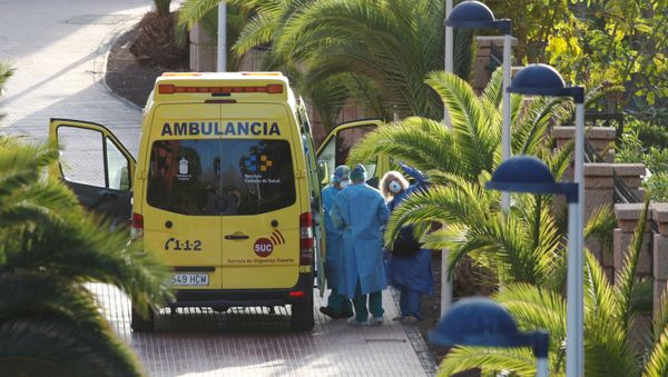 A tourist affected by coronavirus is transferred to a hospital from the hotel H10 Costa Adeje Palace, which is on lockdown after novel coronavirus has been confirmed in Adeje, on the Spanish island of Tenerife, Spain, February 29, 2020. REUTERS/Borja Suarez A tourist affected by coronavirus is transferred to a hospital from the hotel H10 Costa Adeje Palace, which is on lockdown after novel coronavirus has been confirmed in Adeje, on the Spanish island of Tenerife, Spain, February 29, 2020. REUTERS/Borja Suarez - Sputnik International