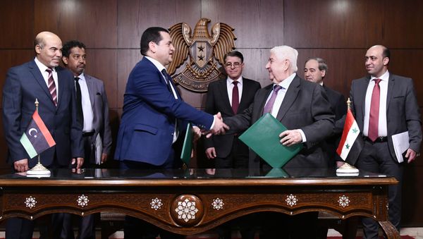 In this photo released by the Syrian official news agency SANA, Syrian Foreign Minister Walid al-Moallem, third right, meets with officials from Libya's east-based government, in Damascus, Syria, Sunday, March 1, 2020. - Sputnik International