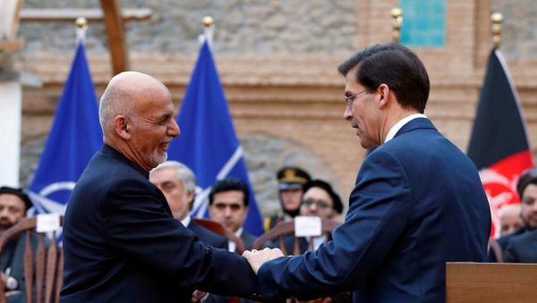 Afghanistan's President Ashraf Ghani shakes hands with U.S. Defense Secretary Mark Esper, during a news conference in Kabul, Afghanistan February 29, 2020.  - Sputnik International