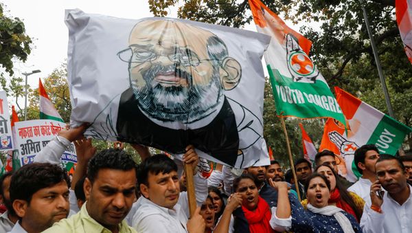 Activists of the youth wing of India's main opposition Congress party show slogans during a protest demanding the resignation of Home Minister Amit Shah following last week's clashes between people demonstrating for and against a new citizenship law, in New Delhi, India March 2, 2020. Activists of the youth wing of India's main opposition Congress party show slogans during a protest demanding the resignation of Home Minister Amit Shah following last week's clashes between people demonstrating for and against a new citizenship law, in New Delhi, India March 2, 2020. - Sputnik International