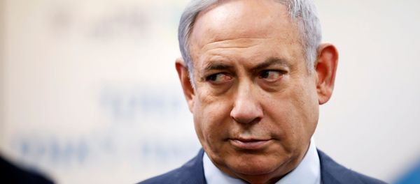 Israeli Prime Minister Benjamin Netanyahu looks on as he delivers a statement during his visit at the Health Ministry national hotline, in Kiryat Malachi, Israel Israeli Prime Minister Benjamin Netanyahu looks on as he delivers a statement during his visit at the Health Ministry national hotline, in Kiryat Malachi, Israel - Sputnik International