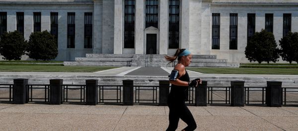 A woman jogs past the Federal Reserve building in Washington, U.S., July 16, 2018 - Sputnik International