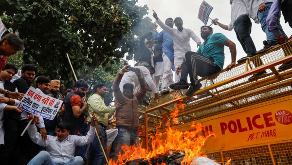 Activists of the youth wing of India's main opposition Congress party show slogans during a protest demanding the resignation of Home Minister Amit Shah following last week's clashes between people demonstrating for and against a new citizenship law in New Delhi, India March 2, 2020.  - Sputnik International