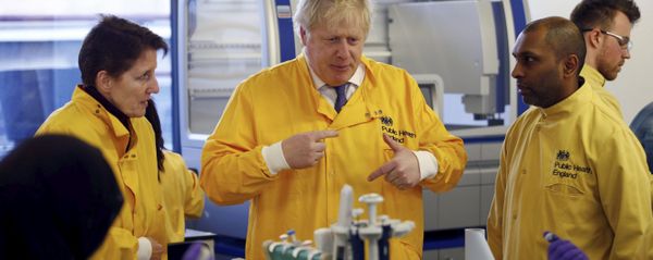 Boris Johnson visiting a Public Health England laboratory in March 2020 Boris Johnson visiting a Public Health England laboratory in March 2020 - Sputnik International