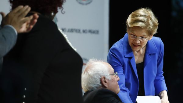 Democratic presidential candidate Sen. Elizabeth Warren, D-Mass., shakes hands with Democratic presidential candidate Sen. Bernie Sanders, I-Vt., after speaking at the National Action Network South Carolina Ministers' Breakfast, Wednesday, Feb. 26, 2020, in North Charleston, S.C. (AP Photo/Matt Rourke) - Sputnik International