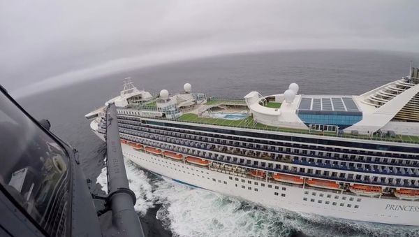 Airmen from the Moffett Federal Airfield based, 129th Rescue Wing deliver coronavirus test-kits to the Grand Princess cruise ship off the coast of California, U.S. in this still image from a handout video obtained by Reuters on March 5, 2020 - Sputnik International