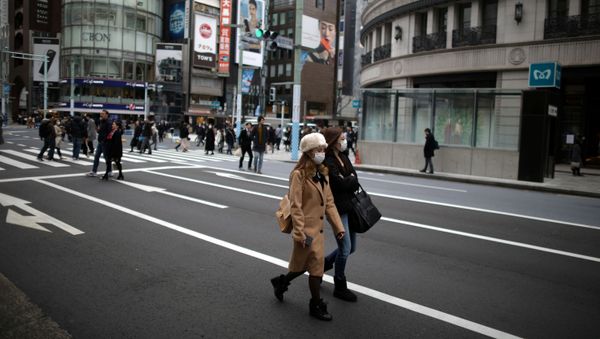 Women, wearing protective face masks walk in Tokyo Women, wearing protective face masks walk in Tokyo - Sputnik International