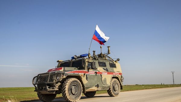 A Russian military police vehicle in the town of Darbasiyah in Syria's northeastern Hasakeh province along the Syria-Turkey border - Sputnik International